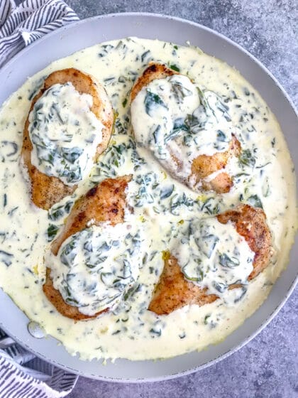 Creamy Chicken Florentine is the perfect date night recipe! The creamy spinach sauce is full of flavor, comes together in one pan, and is perfect served over pasta or rice! #chickenflorentine #creamyspinach #datenight #onepanrecipes | https://withpeanutbutterontop.com