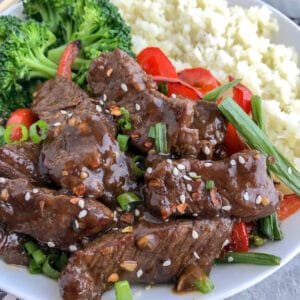 Better AND healthier than PF Chang's classic takeout dish! Full of flavor, but without the guilt! Super simple to make and guaranteed to wow your taste buds! #mongolianbeef #pfchangs #takeout #healthyrecipes #keto #lowcarb | https://withpeanutbutterontop.com
