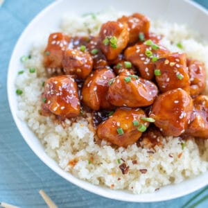 Sweet and spicy Firecracker Chicken served over cauliflower rice.