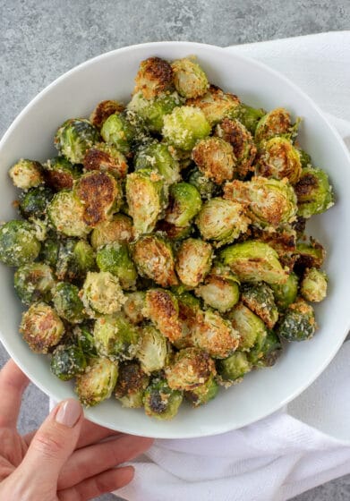 Bowl filled with Crispy Garlic Parmesan Brussels Sprouts.