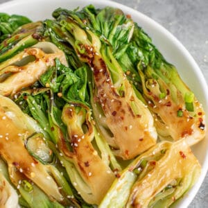 Bowl of sautéed baby bok choy brushed with homemade teriyaki sauce.