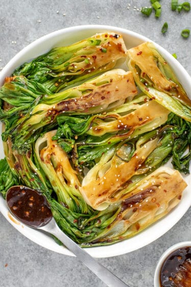 Bowl of sautéed baby bok choy brushed with homemade teriyaki sauce.