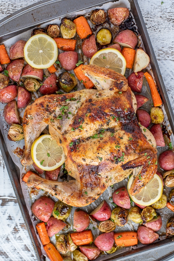Lemon Garlic Butter Butterfly Chicken and Veggies. A pan of chicken and vegetables.
