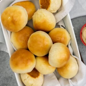 Baking dish filled with dinner rolls.