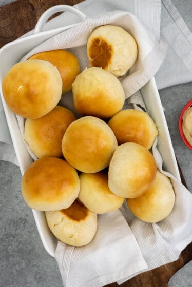 Baking dish filled with dinner rolls.